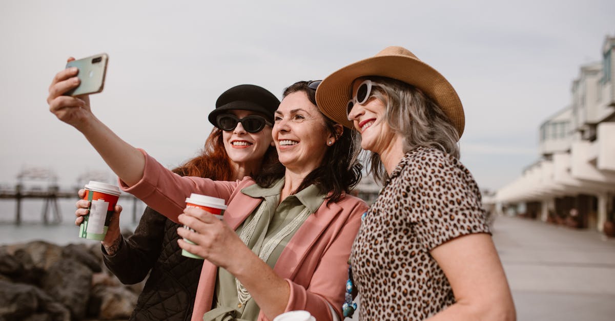 Three women taking a selfie: how do I make friends in midlife?