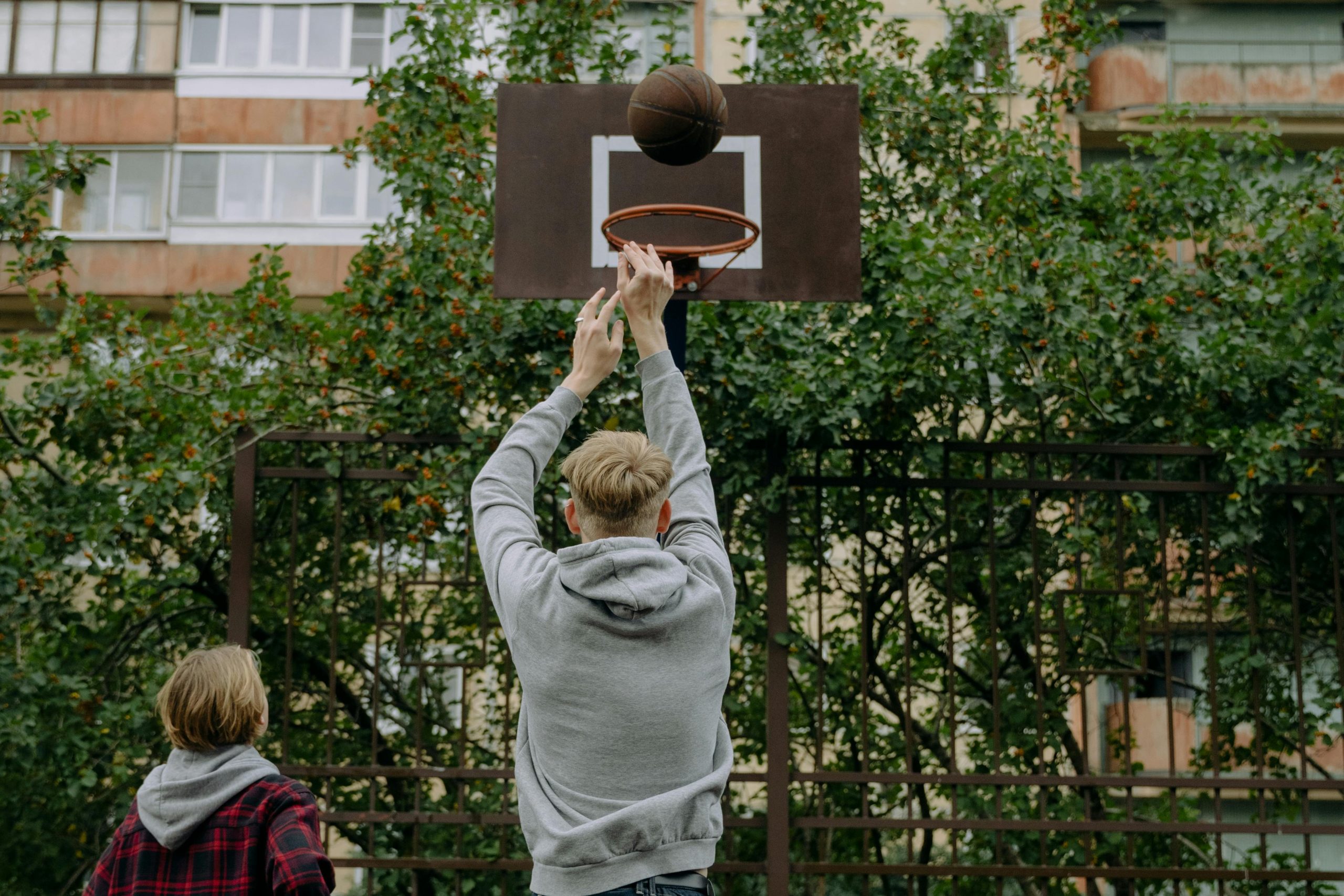 teens playing basketball: can you stop your teen from being friends with someone?