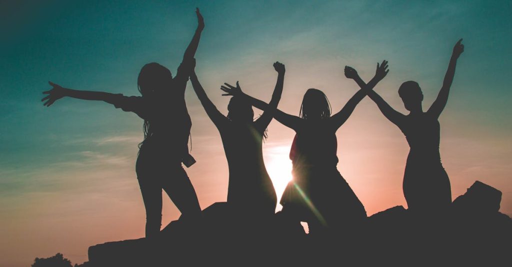 Four women enjoying a sunset: mastering midlife group for women.